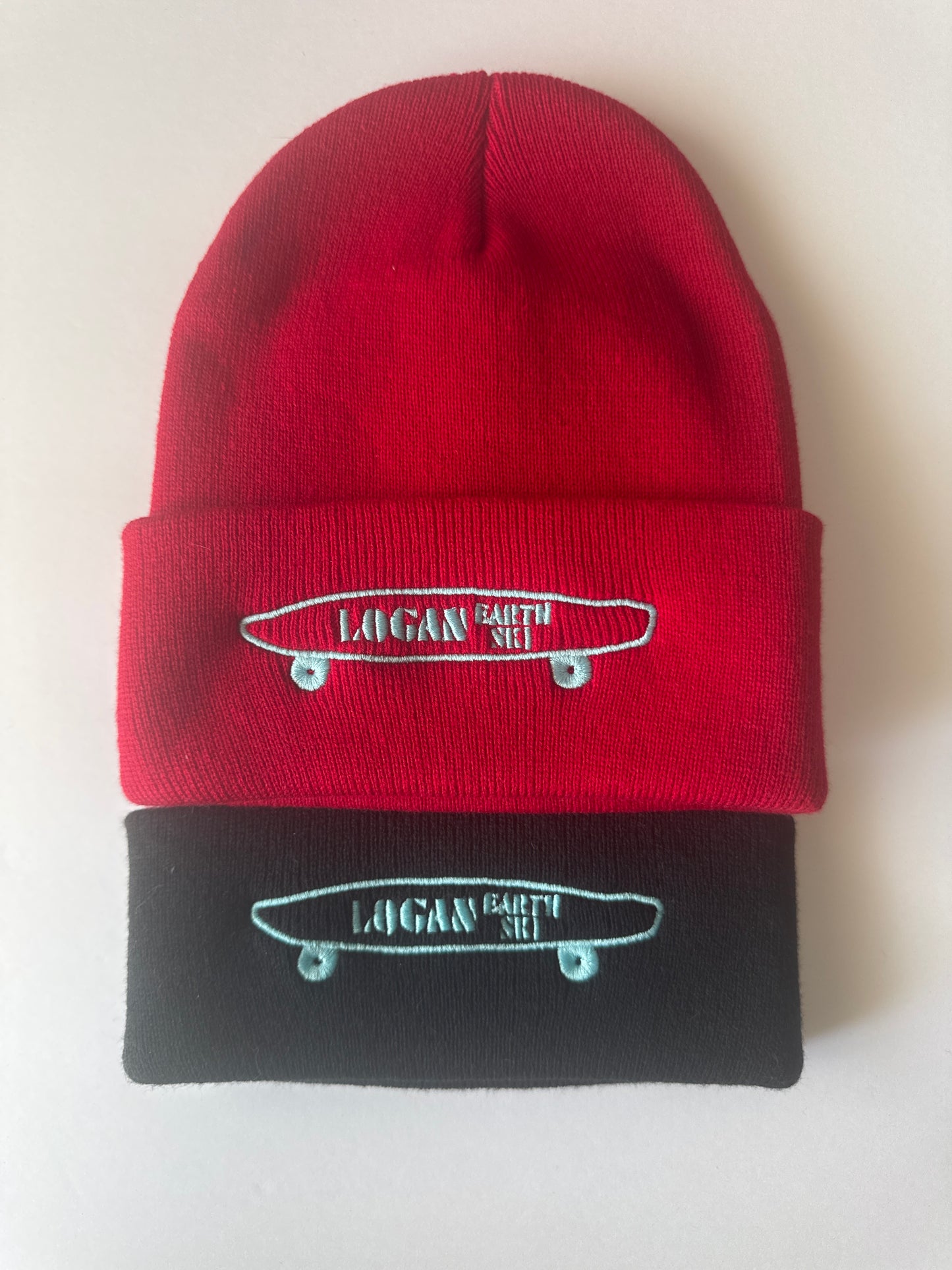 Teal Stitch Logan Skateboard Logo