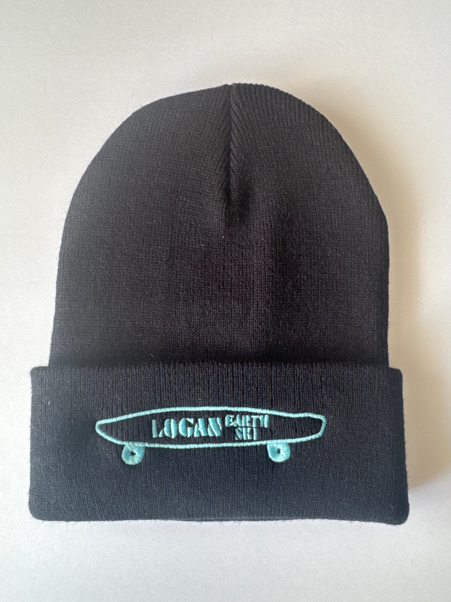 Teal Stitch Logan Skateboard Logo